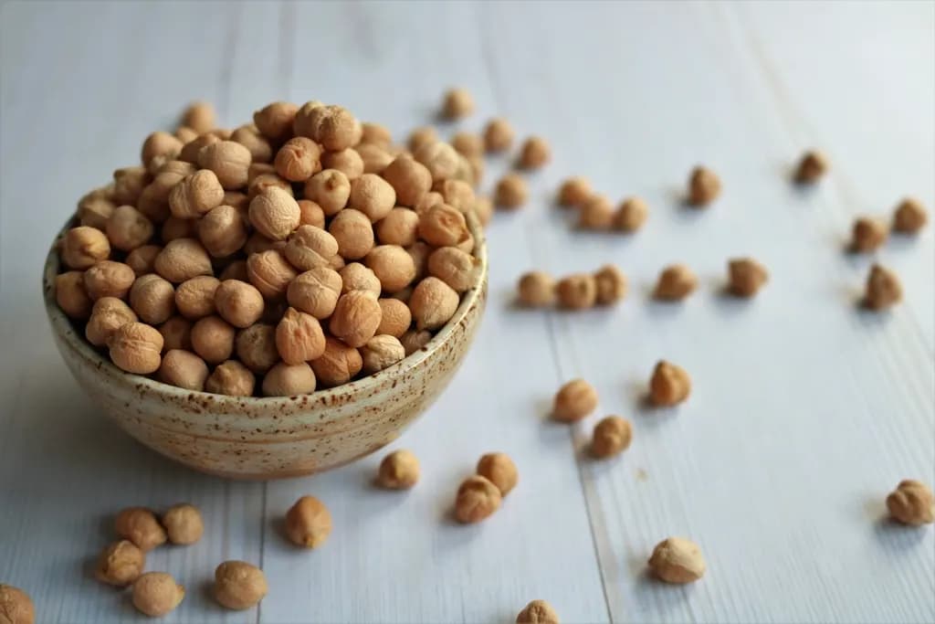 Dried chickpeas in a stoneware bowl
