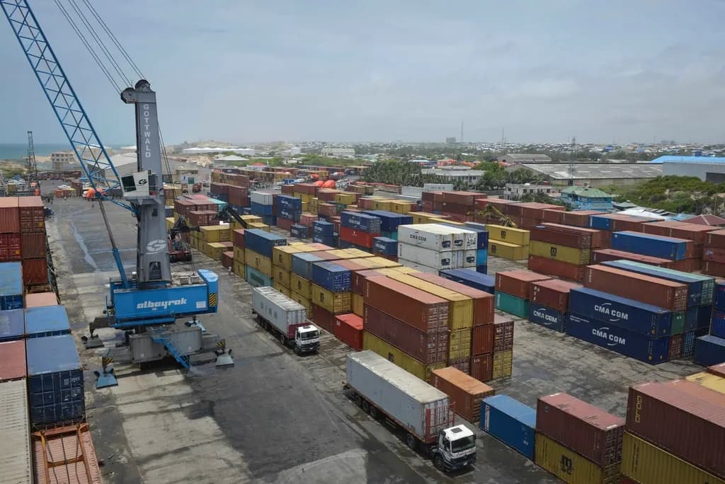 Containers and trucks in a working port yard